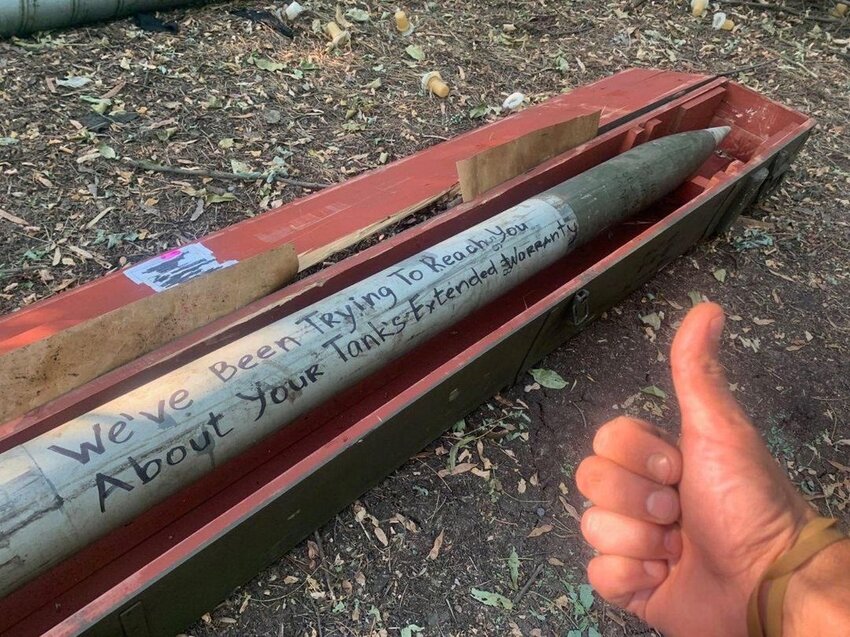 Grad MLRS rocket with 'We've been trying to reach you about your tank's extended warranty' written on it