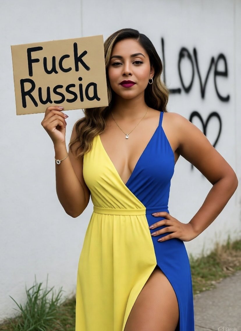 A cute woman in a Ukrainian flag dress holds up a sign saying, 'Fuck Russia.'