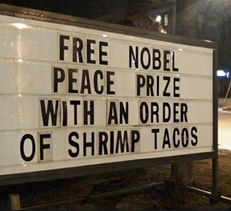 Fast food sign: Free Nobel Peace Prize with an order of shrimp tacos.